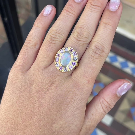 Load and play video in Gallery viewer, One-off Black Opal And Shades Of Pink Sapphire Pebble Ring in 18ct Yellow Gold, Size O and a half (In Stock)
